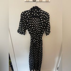 Black with white polka dot vintage style jumpsuit with tie waist belt.